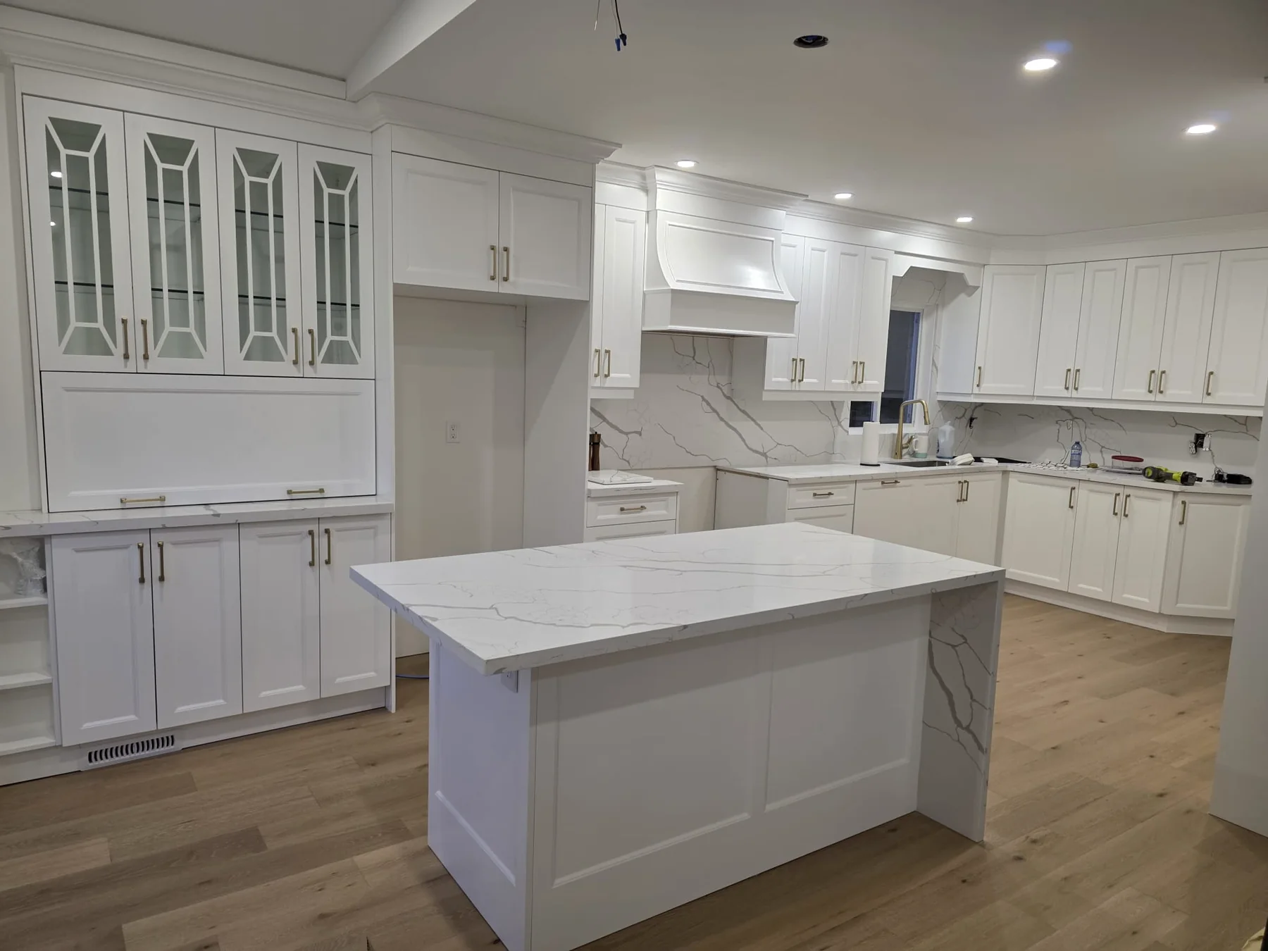 Aligned custom cabinet doors, drawer fronts and fitted kitchen island panels